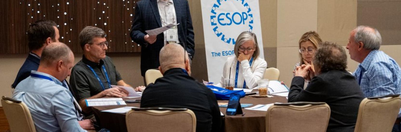 Employee Owned 2025 Workshop with attendees at a table doing an activity
